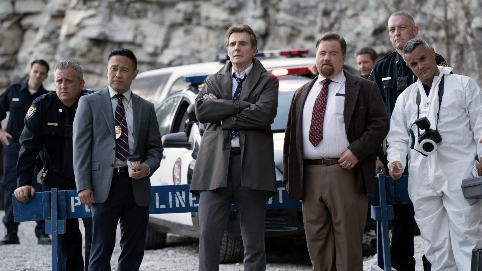 A Group Image of Cops standing around during a crime scene investigation, You would have to watch it to understand.