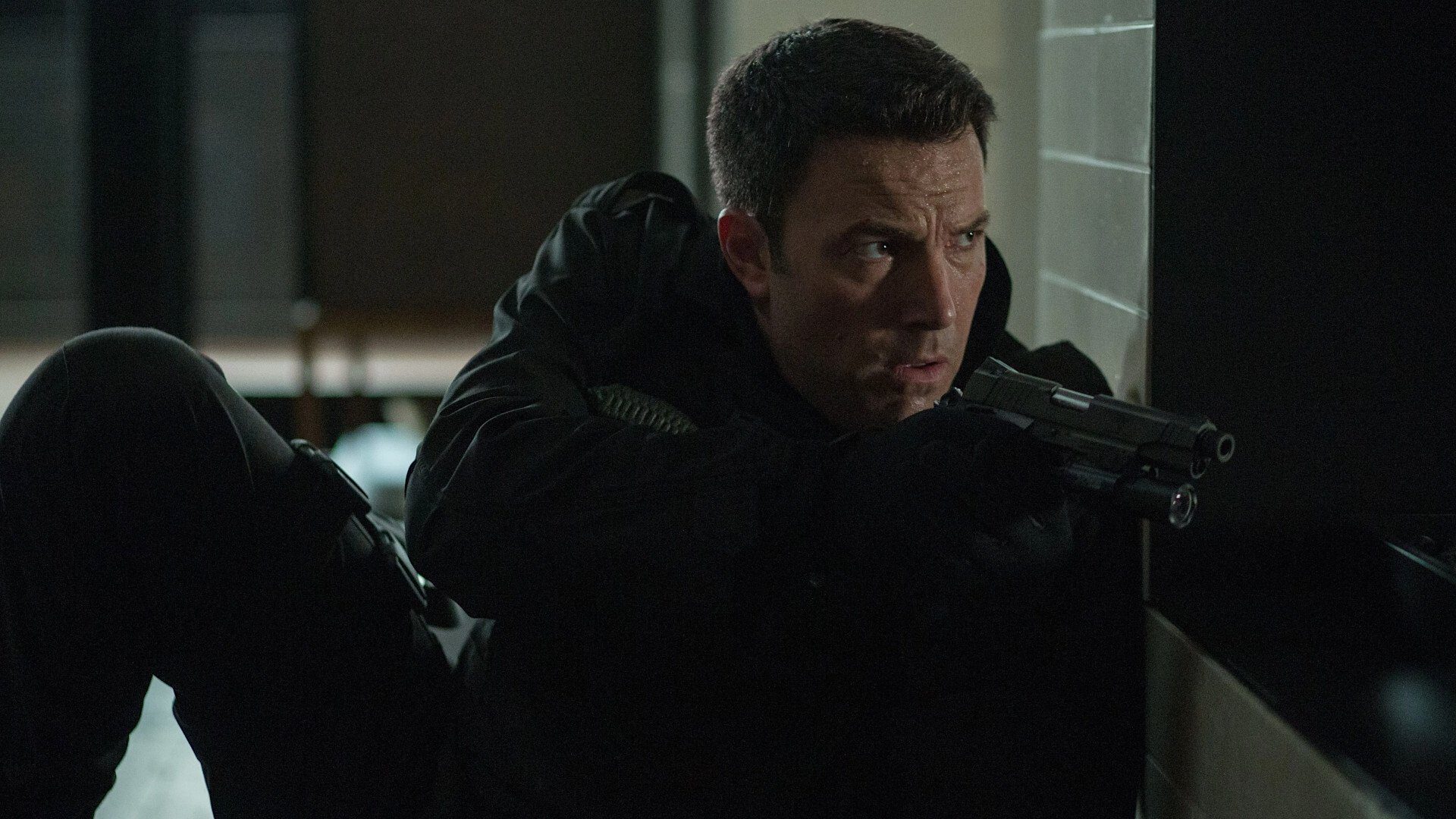 Movie still from The Accountant (2016). Christian Wolff (Ben Affleck) in a tense moment, likely mid-mission, showcasing his sharp focus in The Accountant.