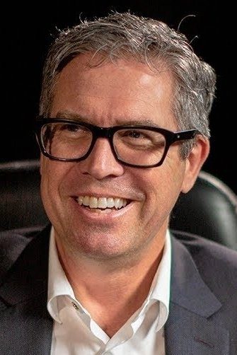 A headshot of John Powell.
