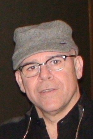 A headshot of Ken Girotti.