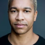 A headshot of Aaron Moten.