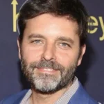 Official headshot photo of person: Andrew Guest.
